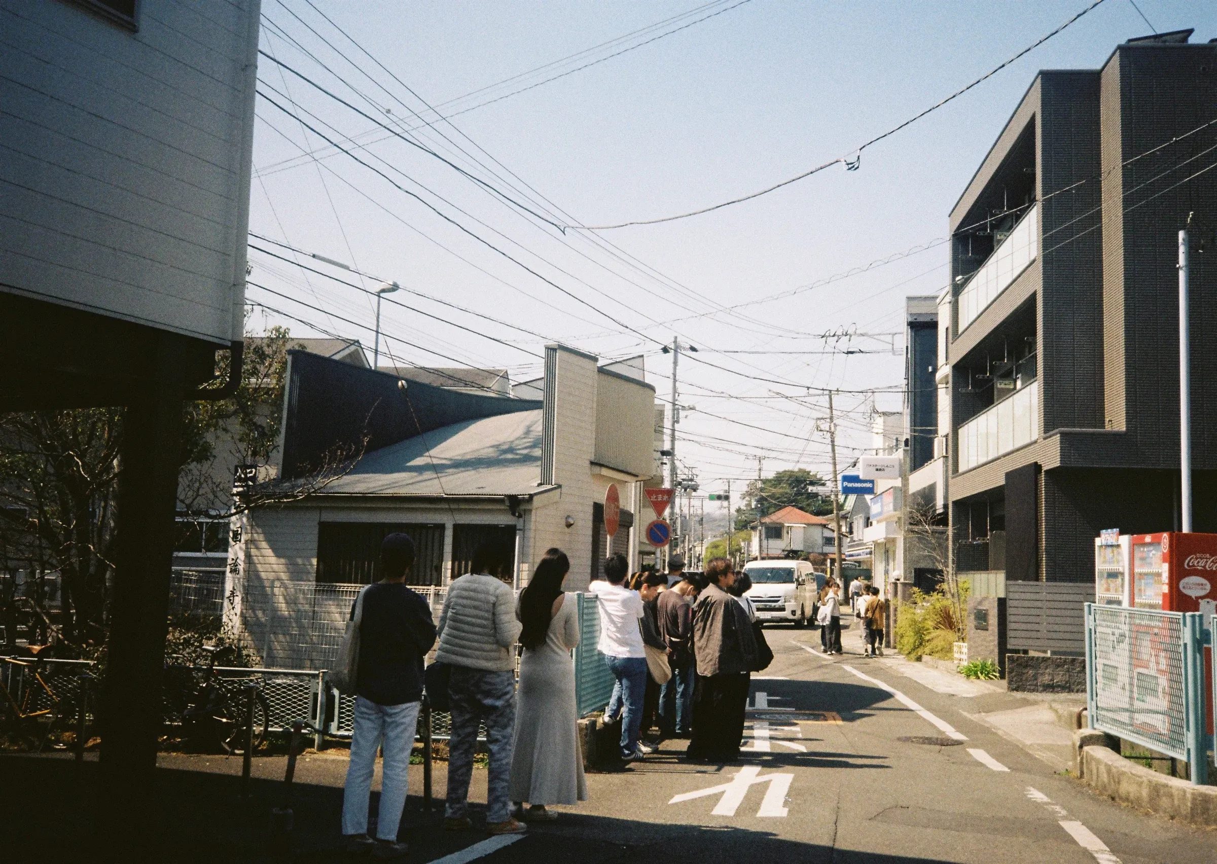 Customers waiting outside Pide on a sunny Omachi street